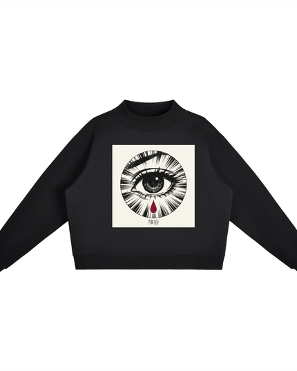 Shinsei mock-neck sweatshirt in black, front: manga-style eye with a red tear on a cream panel