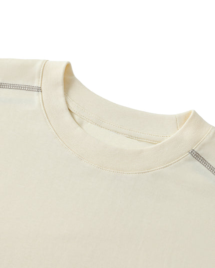 Grey contrast stitching around the crew neck of the Harmony tee
