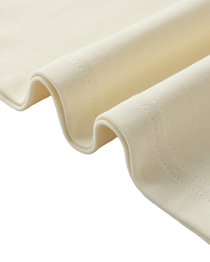 Apricot cotton fabric folds, close-up