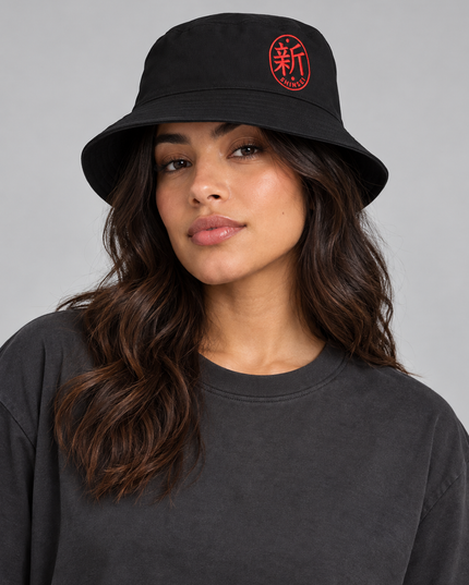 Studio model wearing Shinsei Embroidered Bucket Hat — Cotton Twill