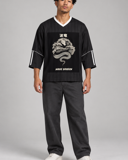 Model wearing the black Wave Dragon jersey in a studio